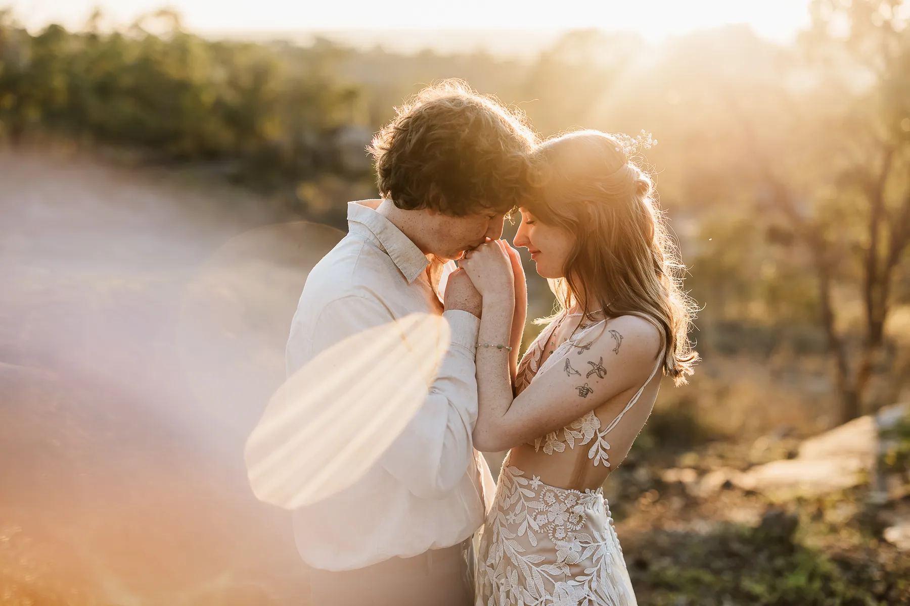 Couple embracing in golden backlight